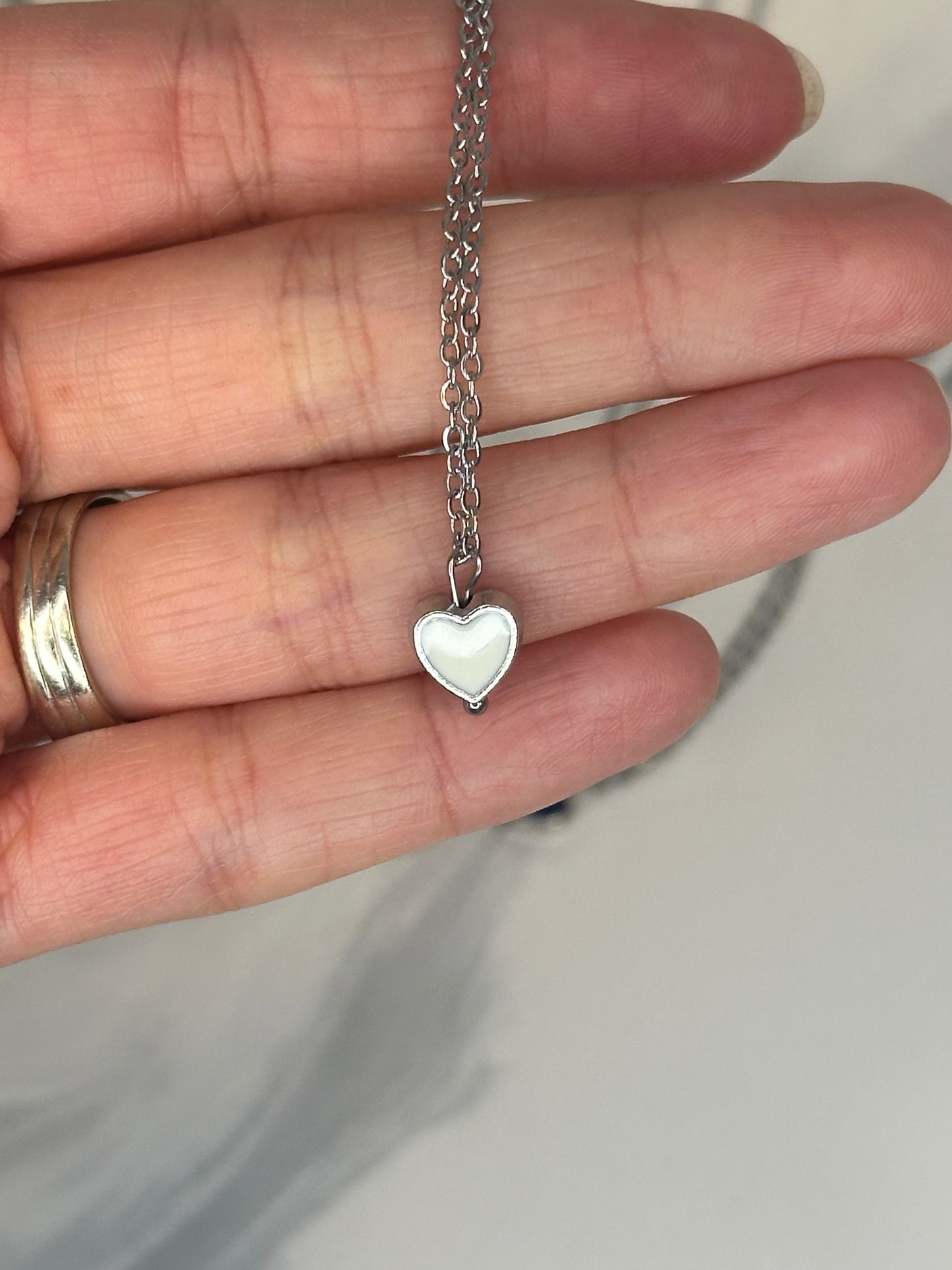 Enamel heart pendant necklaces in assorted colors on silver chain