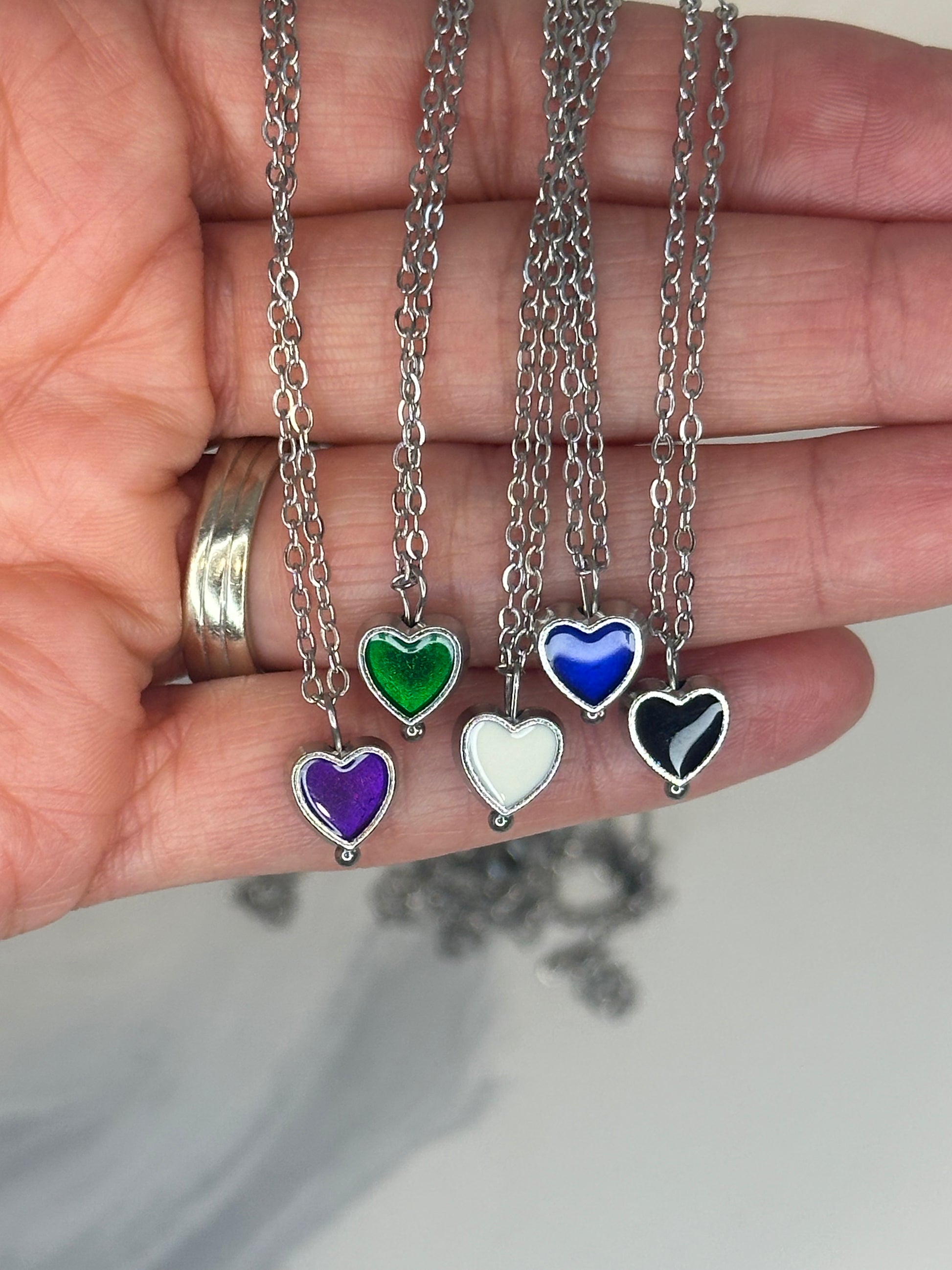 Enamel heart pendant necklaces in assorted colors on silver chain